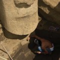 Cleaning petroglyph on front of torso. © EISP.ORG 2013